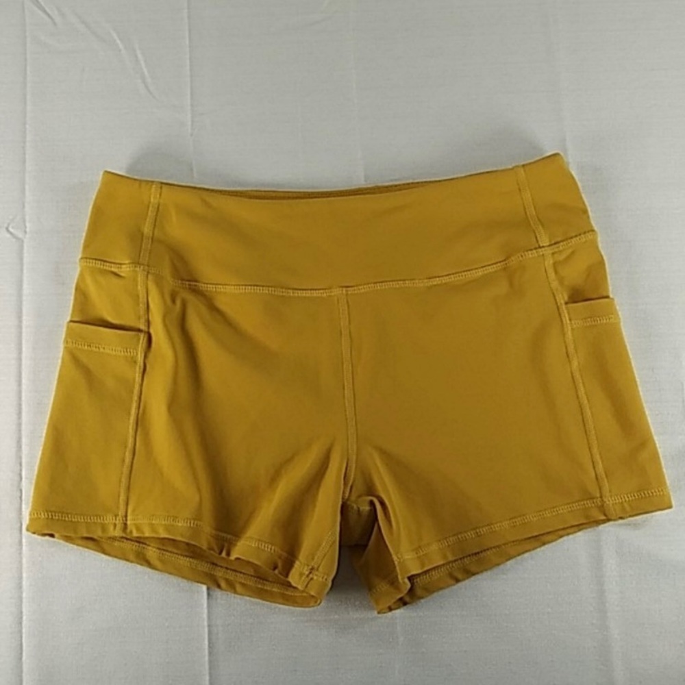 Born Primitive yellow spandex shorts